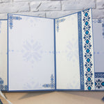 Вътрешни страници на мини албум с шевица в синьо