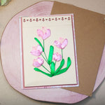 Елегантна ръчно бродирана картичка с розови лалета