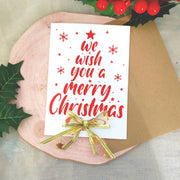 Декоративна 3D картичка с коледни елементи и червен надпис