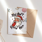 Коледна картичка You Ain’t Gettin’ Shit с усмихнат Дядо Коледа