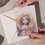 Поздравителна картичка за кръщене с нежна илюстрация на ангел в розово.